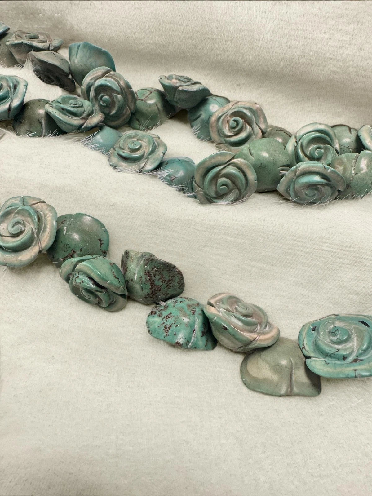 Blue carved rose double-strand necklace - worn view