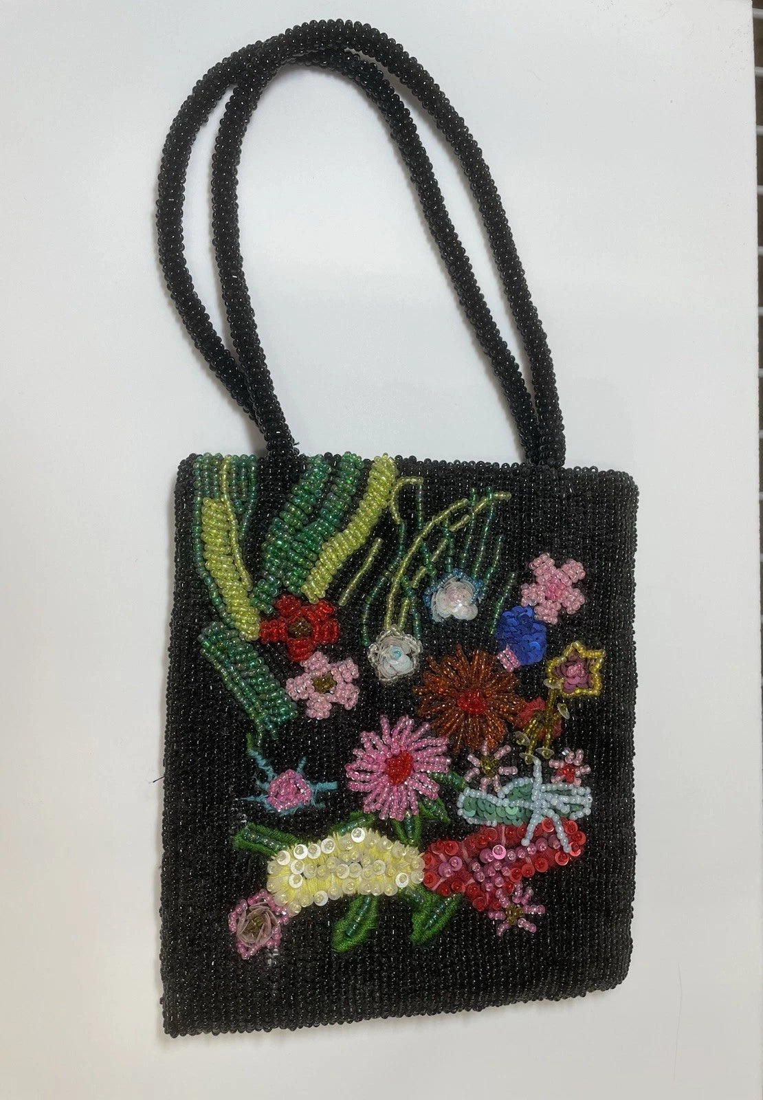 Black beaded floral tote bag - detail view