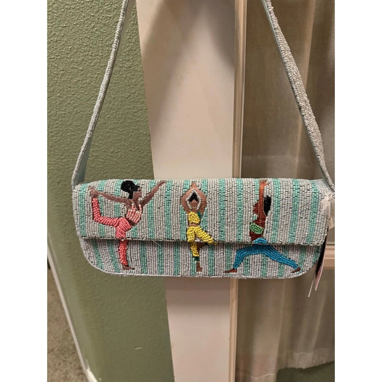 Mint green yoga beaded crossbody clutch bag - front view